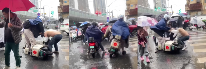 雨天街头搞笑一幕 路怒男瞬间变软蛋 被按地狠揍笑喷全场